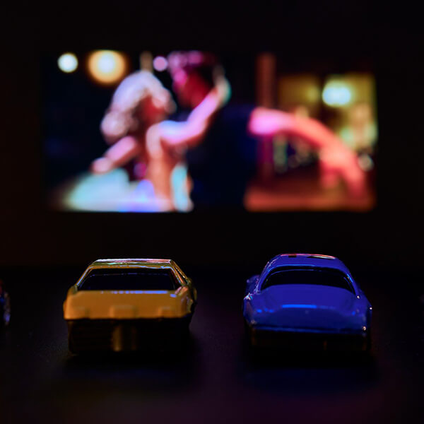 toy cars set up at a make believe drive-in theater