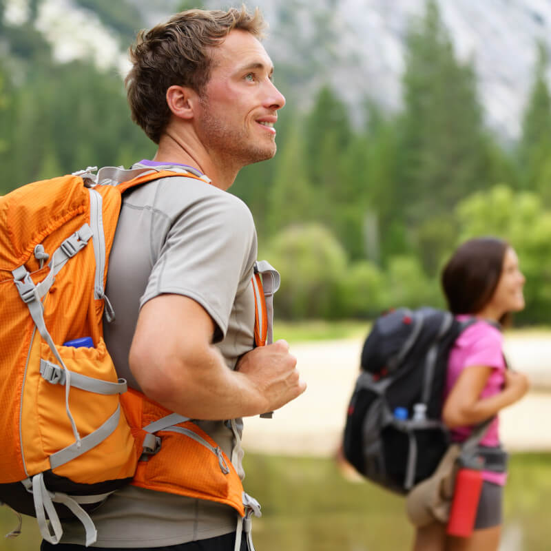 couple backpacking in open wilderness