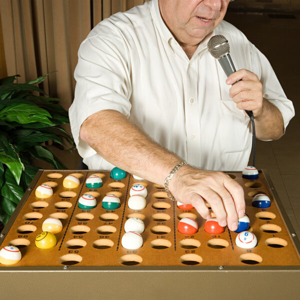 man running a bingo game