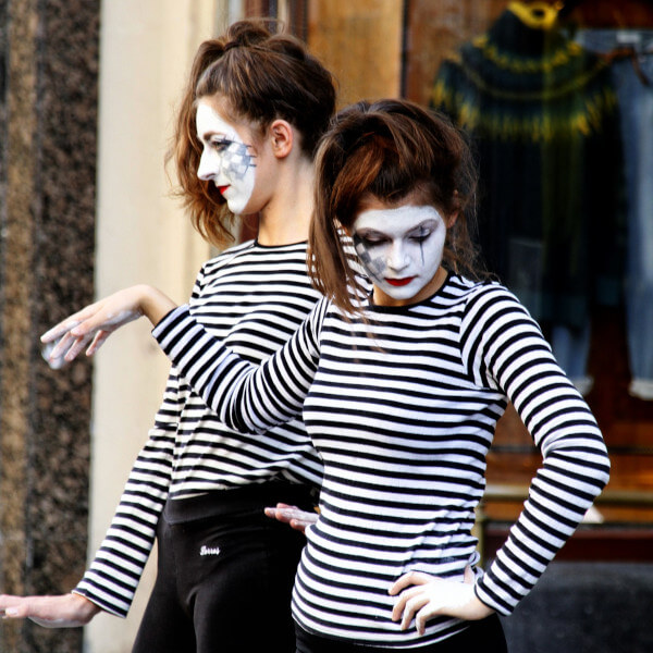 two female mimes performing